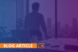 Silhouette of a professional reviewing an IT project timeline at his desk overlooking a city skyline.